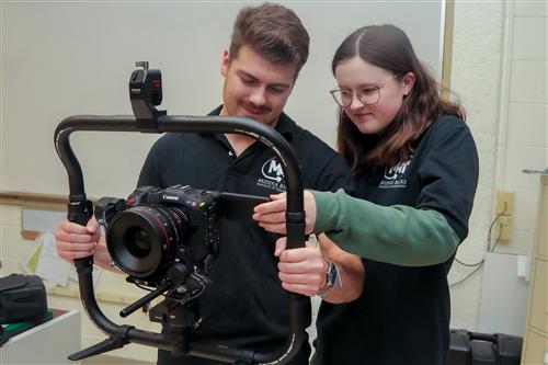 Christian and Samantha work with the camera gimbal